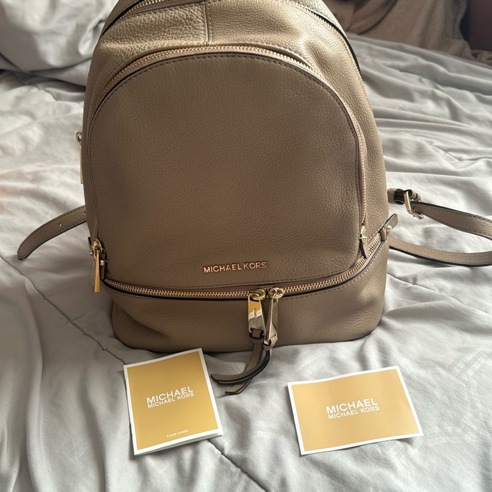 Michael Kors Rhea zip leather backpack in color truffle